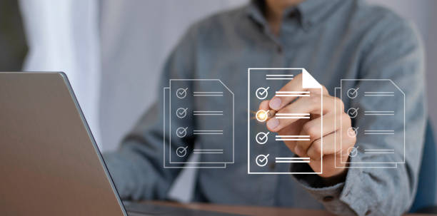 istock Concept of electronically checking smart items and documents on a virtual screen. Businessman checks electronic documents Borderless communication technology 2173714187