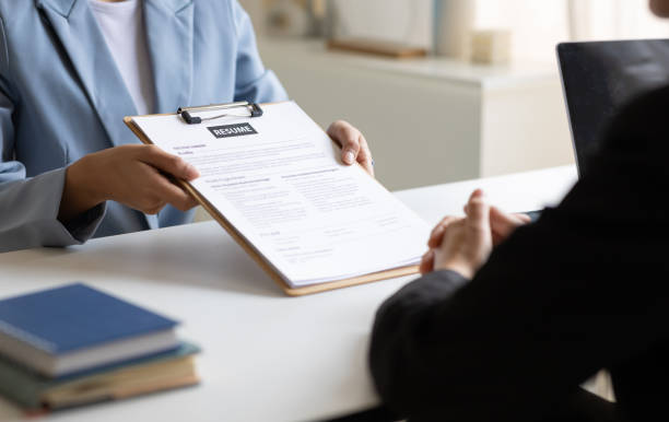 istock Job searching, Applicants submit application documents and resumes during job interviews in the office. Job interview 2173720371