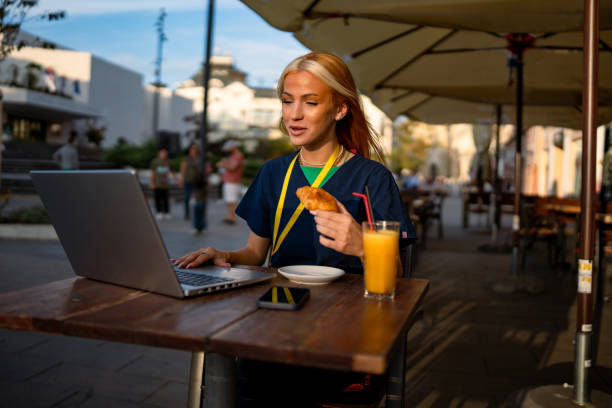 istock Woman enjoying snack while working in cafe. 2173721506