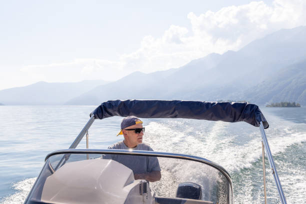 istock Man Driving a Speedboat on a Serene Lake 2173722891