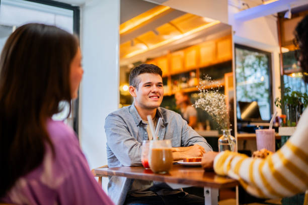 istock Young man talking with friend in breakfast at coffee shop 2173722969