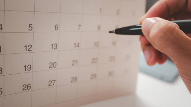 istock Event planner timetable agenda plan on year 2024 schedule event. Business checking planner on mobile phone, taking note on calendar desk on office table. Calendar event plan, work planning 2173723875