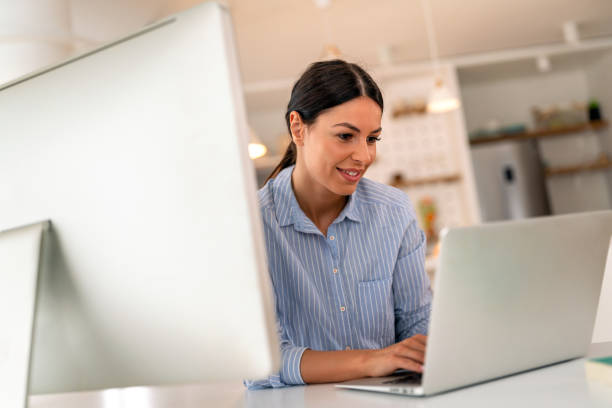 istock Young beautiful woman using computer to check social media, working or read emails. 2173724400