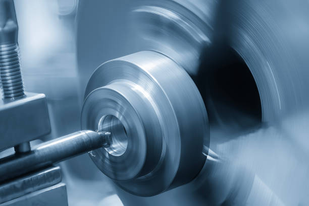 istock The CNC lathe machine boring cut process the cast iron parts. 2173728998