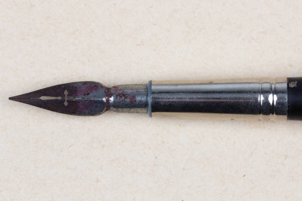istock Fountain pen on an antique textured paper. 2173732673