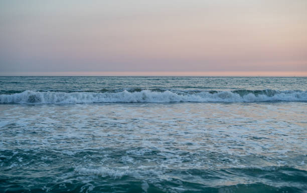 istock Aqua Blue Ocean Pretty Pink Sunset Waves 2173737675