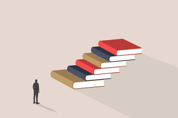 istock businessman standing in front the books. concept of success, education level and skill development 2173737746