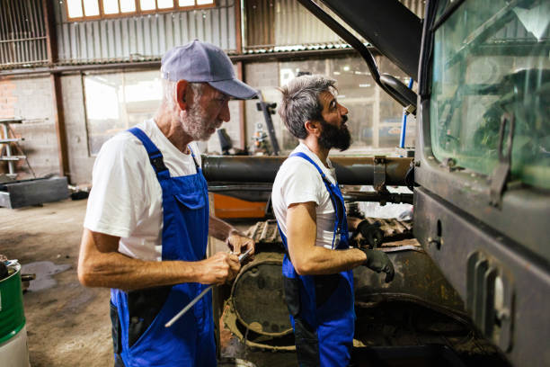 istock Blue Collar Mechanics Repair Excavator 2173737839