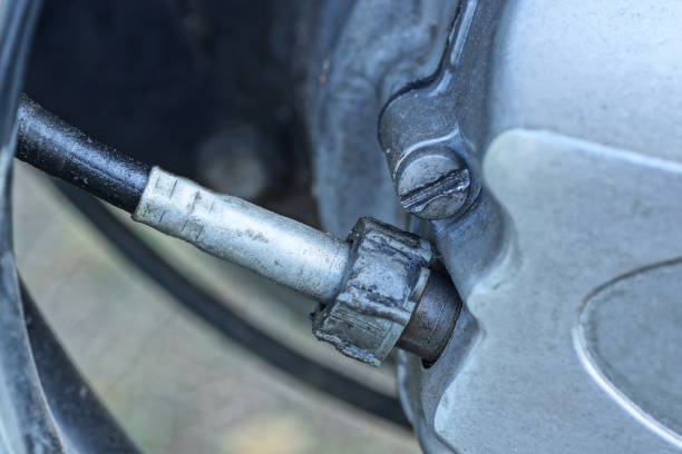 istock detail on old motorcycle from brake cable on grey iron panel 2173744790