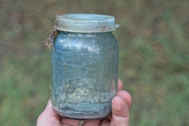 Jar with sausages in women hand.