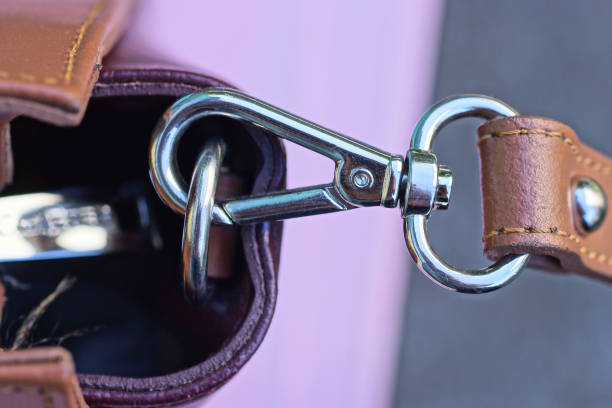 istock metal latch with a ring on the strap of a brown leather bag 2173745152
