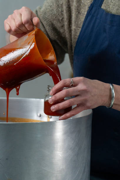 istock Pouring Homemade Rosehip Jam into a Jar 2173750085