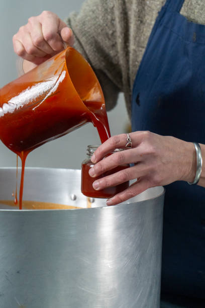 istock Pouring Homemade Rosehip Jam into a Jar 2173750100
