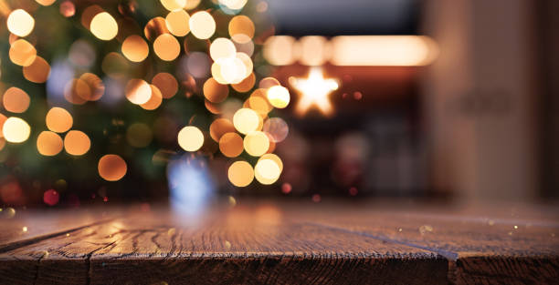 istock Wooden background with blur effect. Christmas tree and garland lights 2173750900