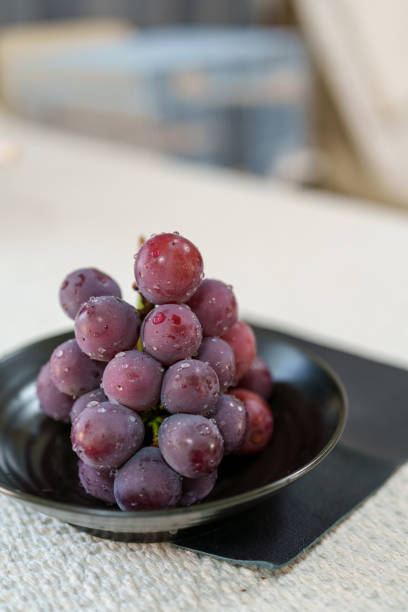 Grapes in a plate on the table