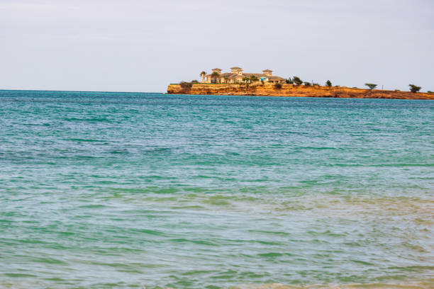 Caribbean beach with white sand, deep blue sky and turquoise water