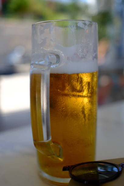 istock fresh beer in front of the mediterranean sea 2173762513