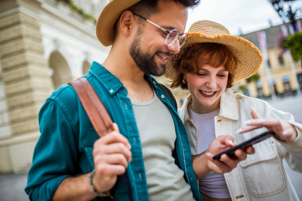 istock Young couple, on a vacation, exploring the new city and using their phone 2173766096
