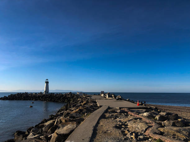 istock Rocky coastline path leading to lighthouse 2173769803