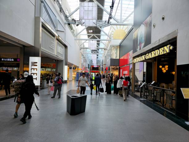 Kista Galleria is a shopping mall located in the Kista Science City in Stockholm, Sweden. It has 185 stores, including a multiplex, bowling alley, karting track and restaurants. The image shows the main hall with several people.