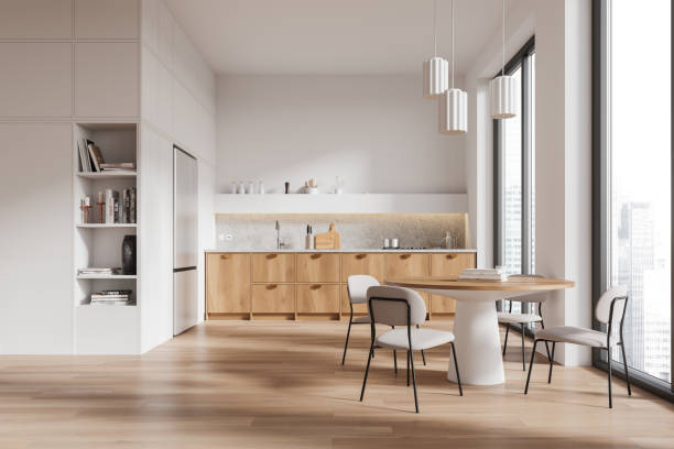 istock Modern kitchen with wooden cabinets and dining area in bright interior. 3D Rendering 2173775812