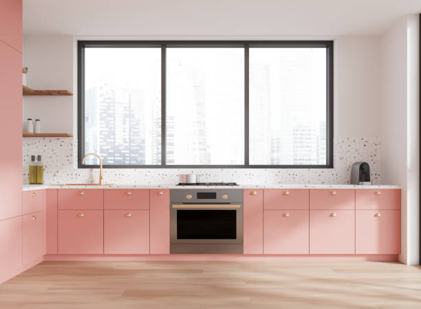 istock Colored home kitchen interior with cooking cabinet and panoramic window 2173776733