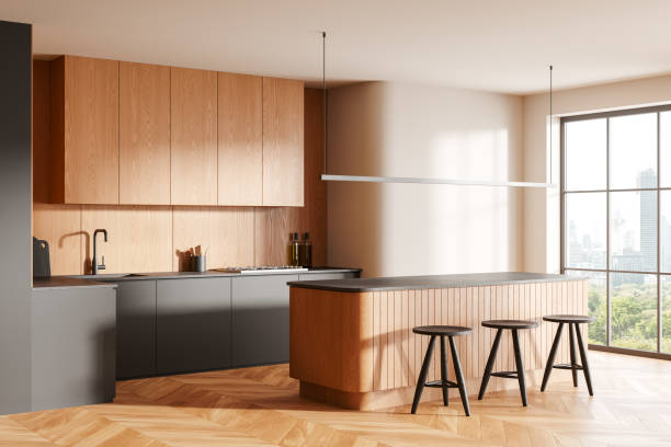 istock Luxury home kitchen interior with cooking cabinet and counter, panoramic window 2173777245