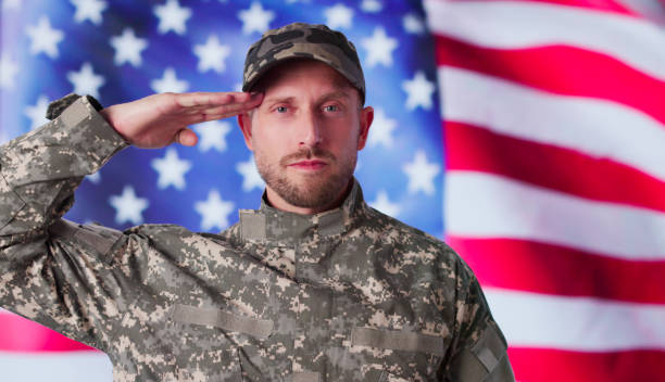istock Military US Soldier Saluting Flag 2173783054