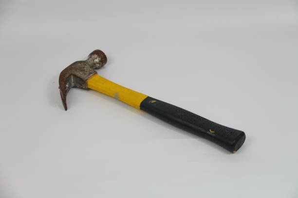 istock Rusty Hammer with Yellow and Black Rubber Grip for Heavy-Duty Use. 2173786766