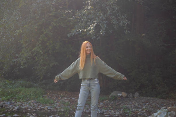 Woman relaxing and enjoying time in nature on sunny day