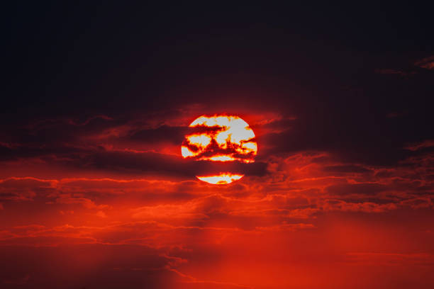Fiery red California sunrise with dramatic layers of clouds.