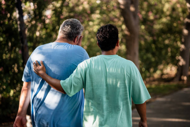 istock Lgtb interracial couple walking in a park 2173802205