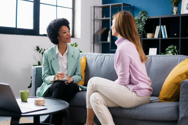 istock Female therapist talking with woman patient on sofa 2173803672