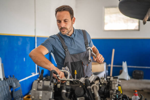 istock Car mechanic work on a car engine in an auto repair workshop 2173808780