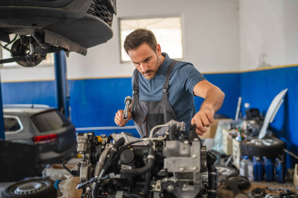 istock Car mechanic work on a car engine in an auto repair workshop 2173808887