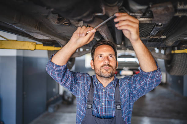 istock Car mechanic use a wrench to repair automobile undercarriage system 2173809015