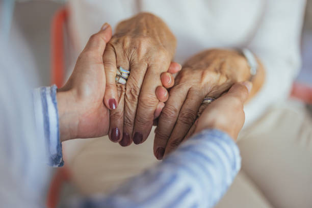 istock Close-Up of Caring Hands Embracing in Comfort and Support 2173809017
