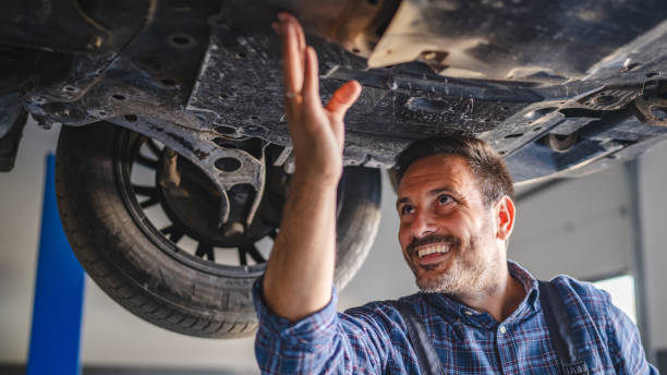 istock Car mechanic hold part of automobile undercarriage system 2173809173