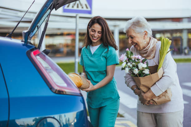 istock Caregiver Assisting Elderly Woman with Grocery Loading 2173809367