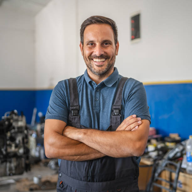 istock Car mechanic smile confidently with at garage 2173809696
