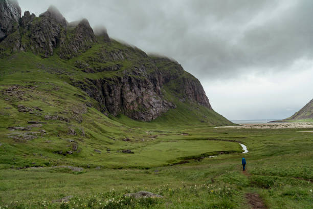 istock Exploring the Magnificent Bunes Beach Cliffs in Lofoten Islands, Norway, on a Cloudy Hiking Adventure Through Lush Green Valleys 2173811601