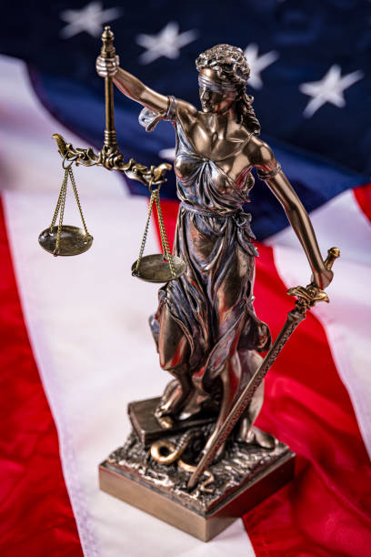 istock Lady Justice on a American Flag Background 2173814236