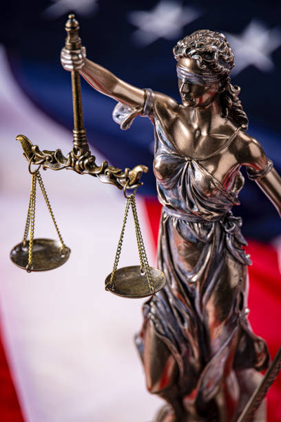 istock Lady Justice on a American Flag Background 2173814239