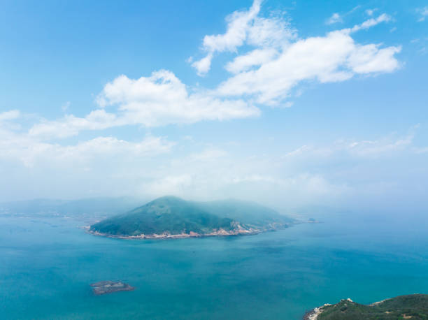 istock An island under the blue sky and white clouds. 2173815512