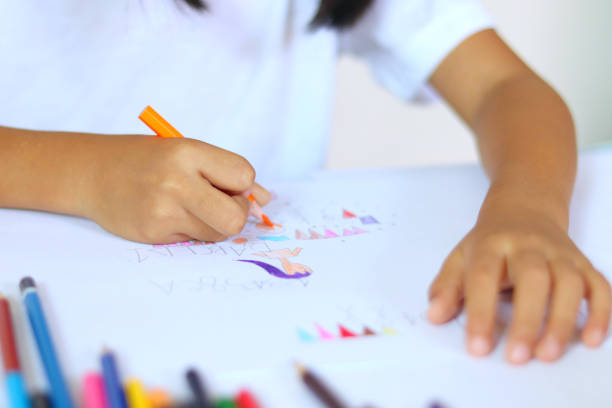 istock There are students coloring in the classroom on the desks. 2173818789