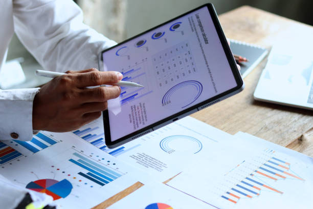 istock A 29-year-old businessman working hard to analyze the company's expense documents. 2173819205