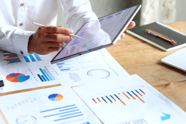 istock A 29-year-old businessman working hard to analyze the company's expense documents. 2173819310
