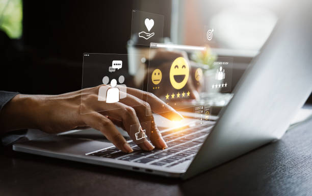 istock User Typing on Laptop to Submit Customer Feedback with Digital Satisfaction Ratings, Featuring Virtual Icons for Positive Review, Customer Service, and Online Consumer Interaction in Business Platform 2173821161