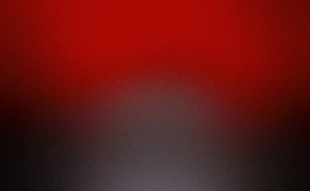 Blurred abstract dark red black noise texture grainy gradient matte frosted glass effect background with blank space.\nRed is the color commonly associated with sacrifice, danger, and courage, heat, activity, passion, sexuality, anger, love, joy, happiness and good fortune.\nGrey or gray is an intermediate color between black and white. It is a neutral or achromatic color, meaning literally that it is without color because it can be composed of black and white. It is the color of a cloud-covered sky, of ash and of lead. Grey is the color commonly associated with neutrality, conformity, boredom, uncertainty, indifference, and modesty. Black commonly associated with mourning, the end, secrets, magic, force, violence, fear, evil, and elegance.