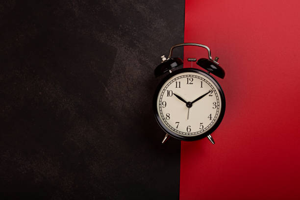 istock Creative promotion composition with alarm clock on black and red background. Flat lay, top view, overhead, mockup, template. Minimal abstract background. Online shopping, sale, promo. Web banner 2173824577